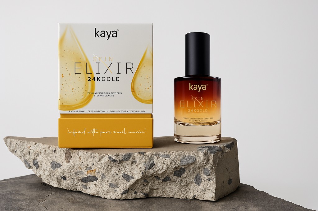 Kaya Skin Elixir 24K Gold packaging box and bottle on stone