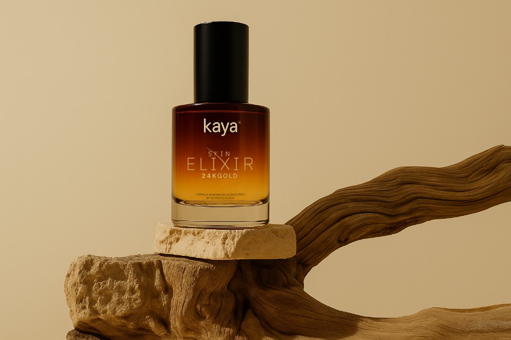 Kaya Skin Elixir 24K Gold serum bottle on wood and stone